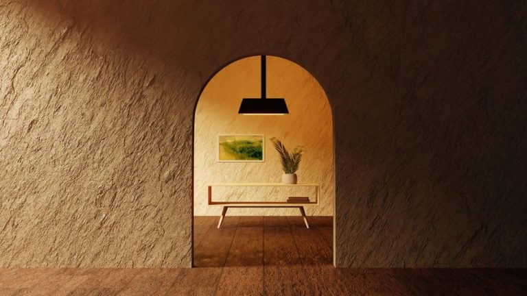 Ruang minimalis dengan dinding bertekstur dan lengkungan pintu